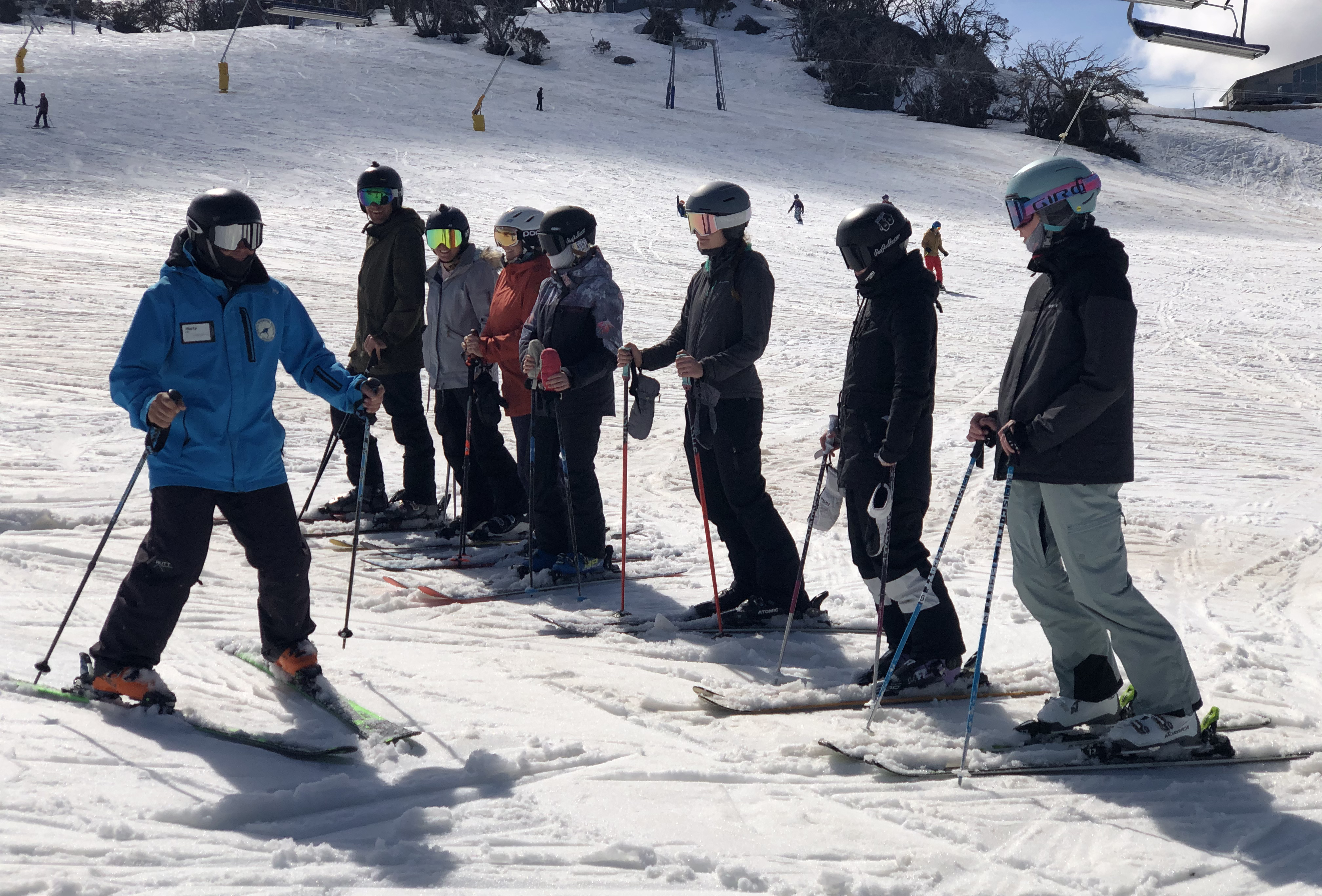 Trainer demonstrating a snowplough